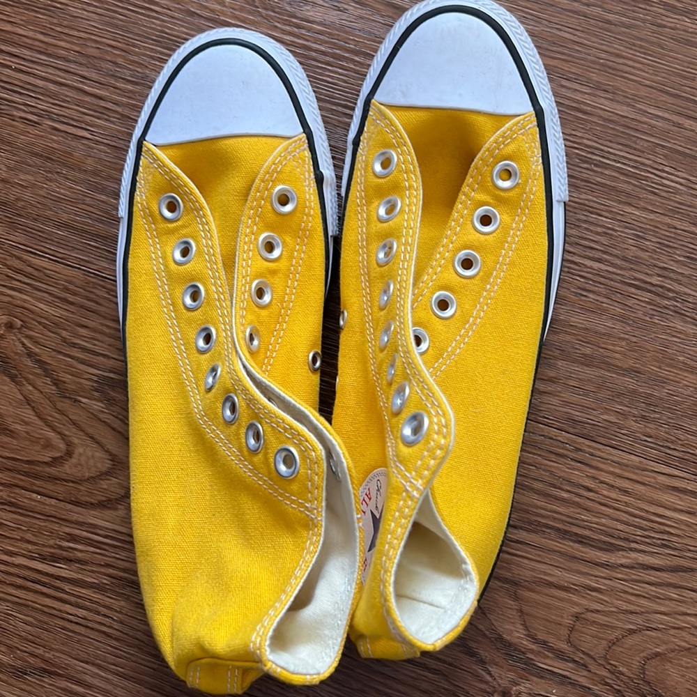 Yellow hi-top Converse